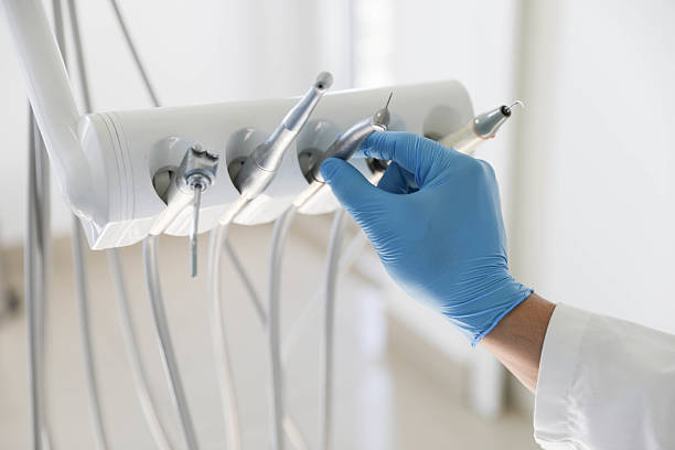Professional Tooth Extraction technician working in Cortland, IL